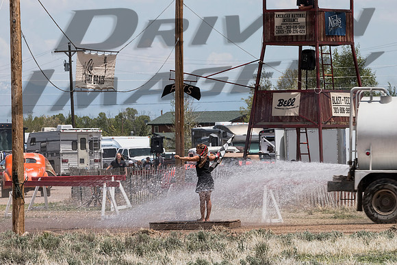 Amy getting  the dust washed off by the water truck - 2