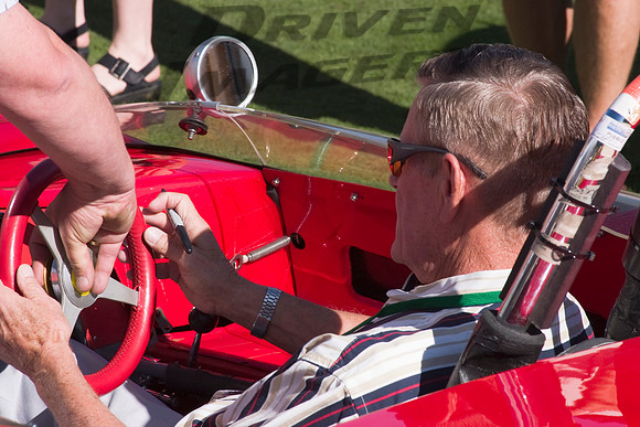 Bobby Unser signing dash of 1962 Lotus 23 - 01